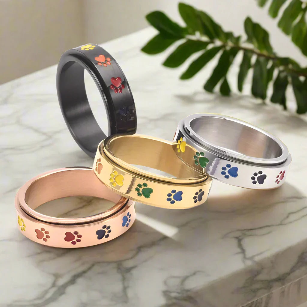 Anillo Antiestrés Giratorio – Acero Inoxidable con Huellas Arcoíris